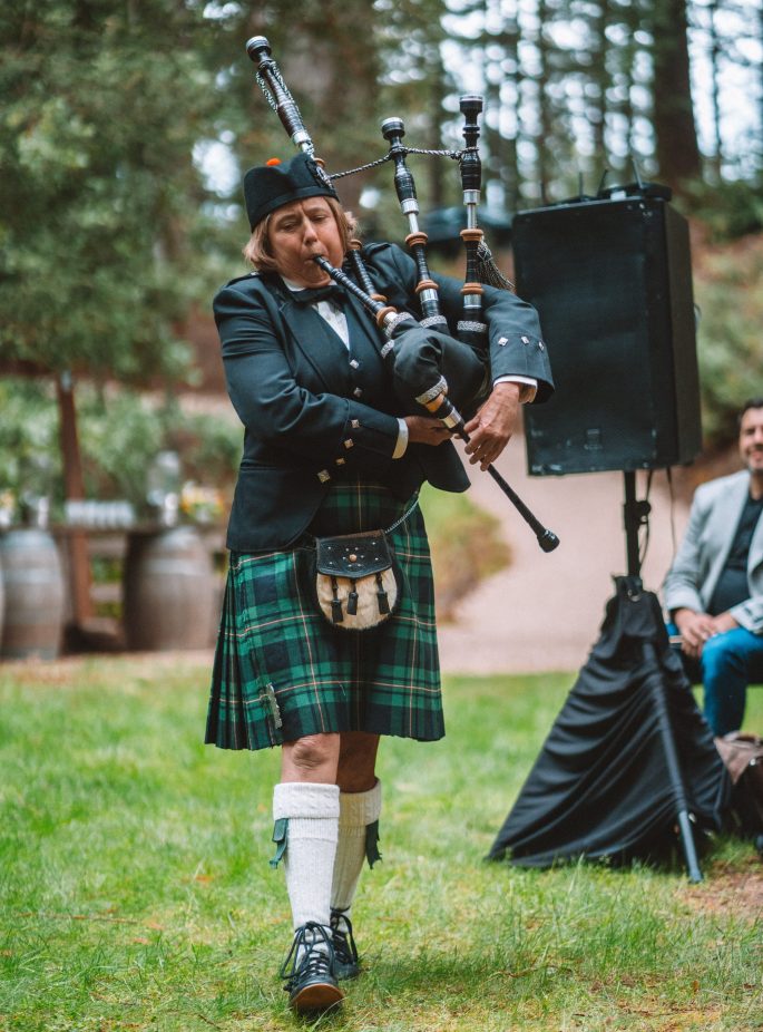 Elise MacGregor Ferrell bagpiping for a wedding in Felton, California.
